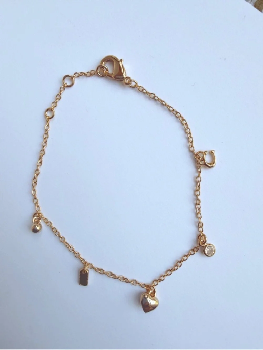 COACH Gold Heart Charm Bracelet with Dainty Charms